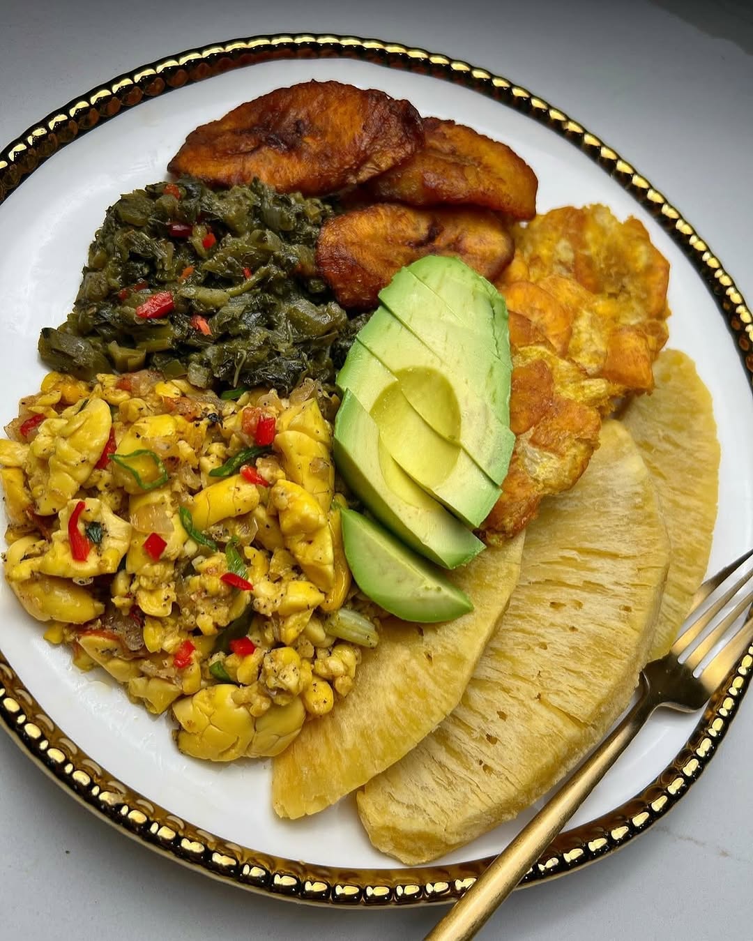 The most ideal Jamaican breakfast- ackee, callaloo, roast breadfruit, ripe fried plantains, green fried plantains, and avacado Anyone agrees #VisitJamaica -@therainaskitchen