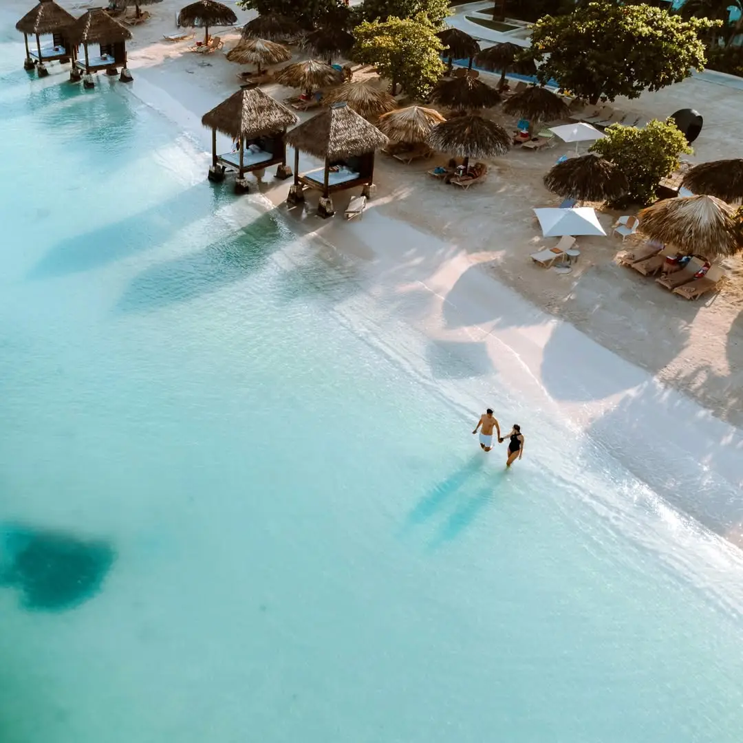 Walking into the blue with you Clear turquoise waters are just a stroll away from the all-new beachfront suites at our #SandalsMontegoBay. Paradise awaits. #SandalsResorts #RomanticTravel